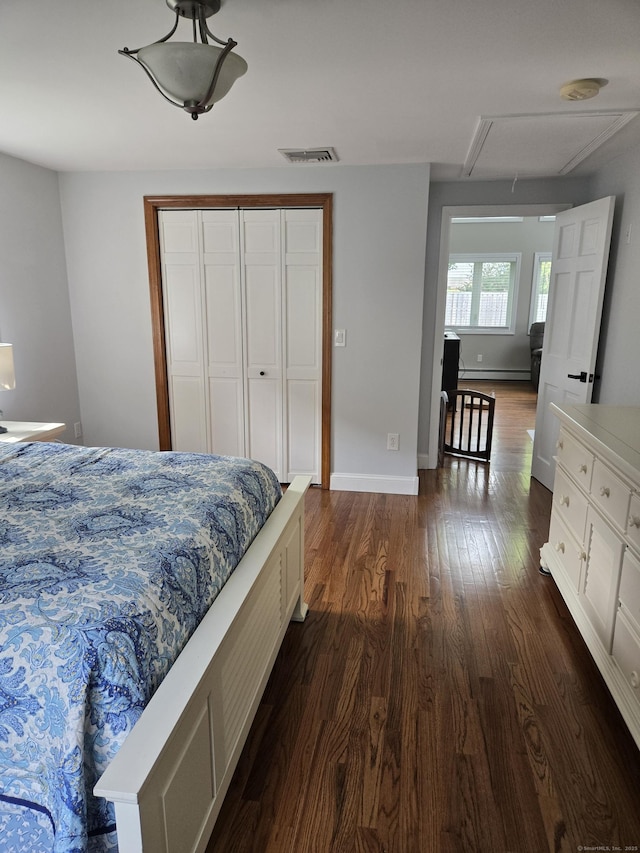 118 Harding Ave, Newington, CT 06111 - bedroom featuring dark wood-type flooring, attic access, a baseboard radiator, and a closet