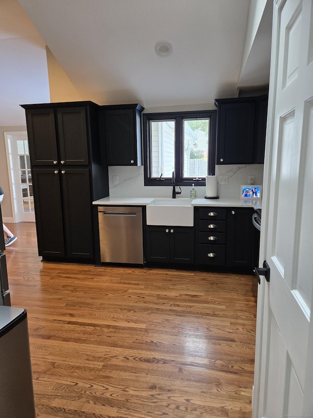 118 Harding Ave, Newington, CT 06111 - kitchen with dishwasher, light wood finished floors, light countertops, and dark cabinetry