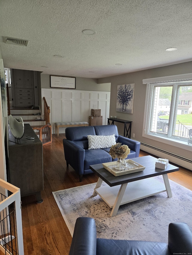 118 Harding Ave, Newington, CT 06111 - living area with wood finished floors and a textured ceiling