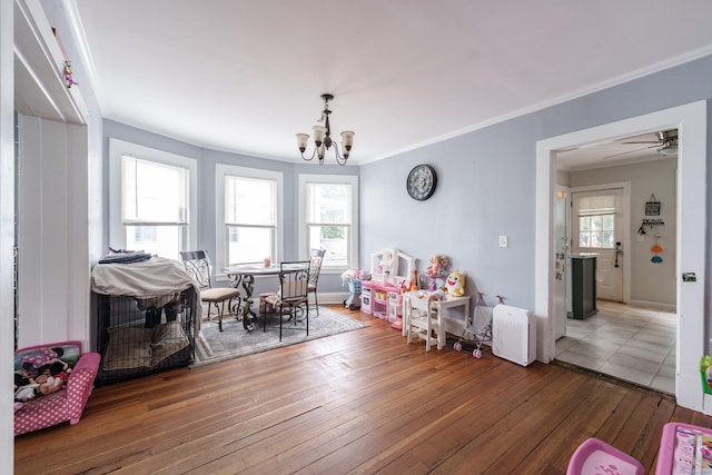 21 Bigelow Ave, Enfield, CT 06082 - dining area with a chandelier, hardwood / wood-style floors, and crown molding