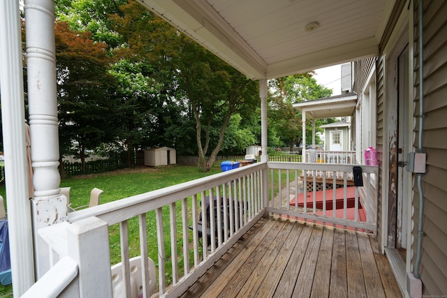 21 Bigelow Ave, Enfield, CT 06082 - wooden deck featuring a storage unit