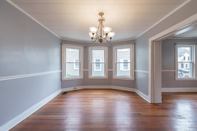 21 Bigelow Ave, Enfield, CT 06082 - unfurnished dining area featuring dark wood finished floors, ornamental molding, and a chandelier