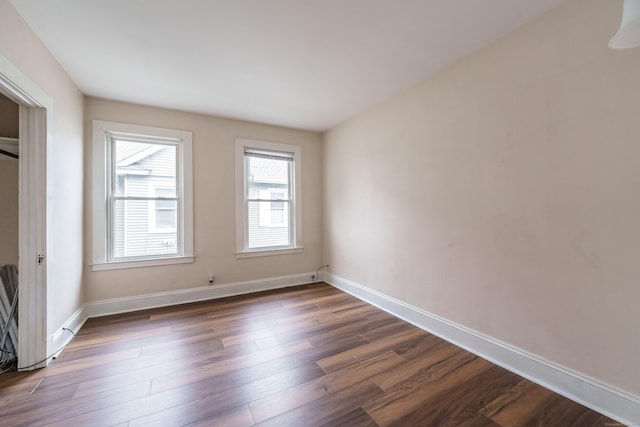 21 Bigelow Ave, Enfield, CT 06082 - unfurnished bedroom with dark wood-type flooring and baseboards