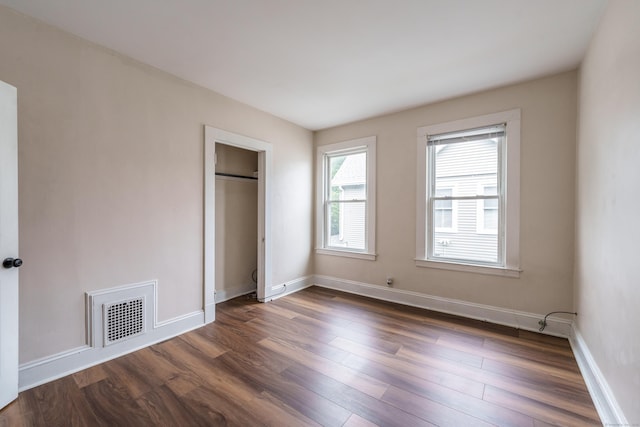 21 Bigelow Ave, Enfield, CT 06082 - unfurnished bedroom with dark wood-style flooring and a closet