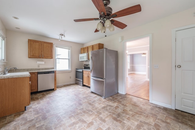 21 Bigelow Ave, Enfield, CT 06082 - kitchen featuring appliances with stainless steel finishes, ceiling fan, and light countertops