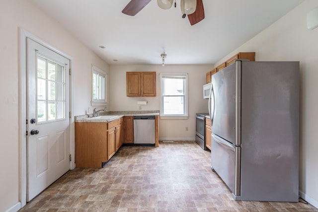 21 Bigelow Ave, Enfield, CT 06082 - kitchen with stainless steel appliances, ceiling fan, plenty of natural light, and light countertops