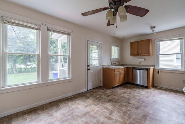 21 Bigelow Ave, Enfield, CT 06082 - kitchen featuring dishwasher, a ceiling fan, light countertops, and brown cabinets