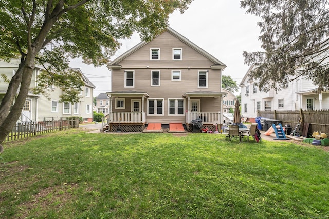 21 Bigelow Ave, Enfield, CT 06082 - back of property with a fenced backyard and a wooden deck