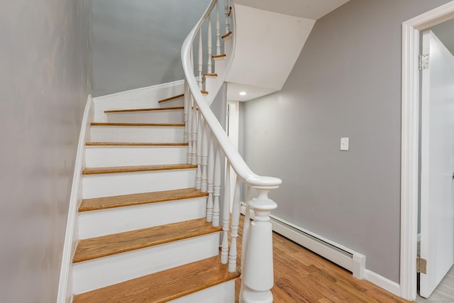 68 School St, Hartford, CT 06106 - staircase with wood finished floors and a baseboard heating unit