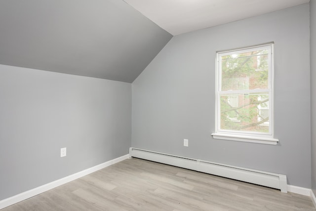68 School St, Hartford, CT 06106 - additional living space featuring a baseboard heating unit, lofted ceiling, wood finished floors, and plenty of natural light