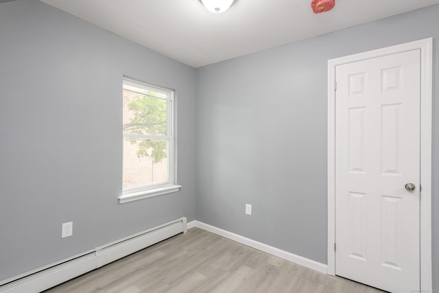 68 School St, Hartford, CT 06106 - spare room with a baseboard heating unit and light wood-style floors