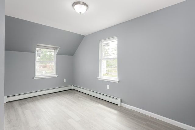 68 School St, Hartford, CT 06106 - additional living space with a baseboard heating unit, wood finished floors, and lofted ceiling