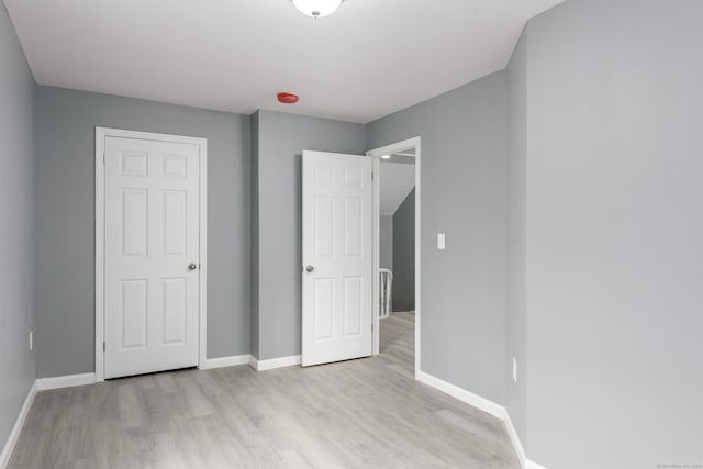 68 School St, Hartford, CT 06106 - unfurnished bedroom with light wood-style flooring and baseboards