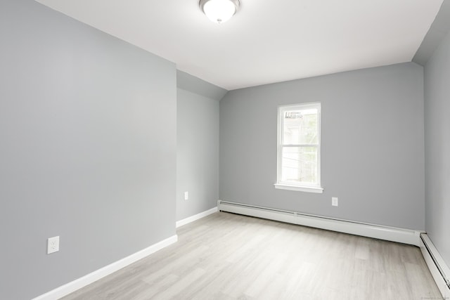 68 School St, Hartford, CT 06106 - empty room featuring baseboard heating, light wood finished floors, and lofted ceiling
