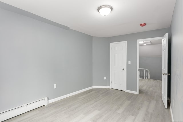 68 School St, Hartford, CT 06106 - unfurnished room with a baseboard radiator and light wood-style flooring