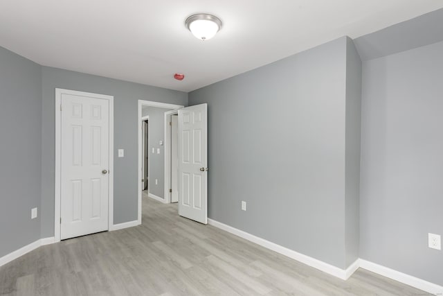 68 School St, Hartford, CT 06106 - unfurnished bedroom featuring light wood-style floors and baseboards