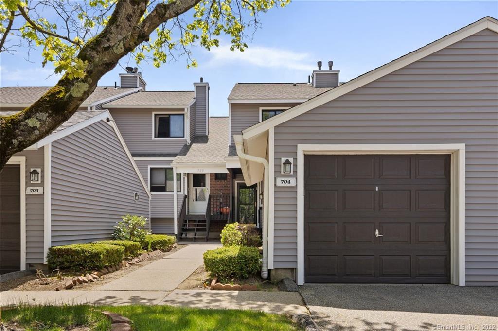 704 Mill Pond Dr Unit 704, South Windsor, CT 06074 - townhome / multi-family property featuring a chimney and a garage