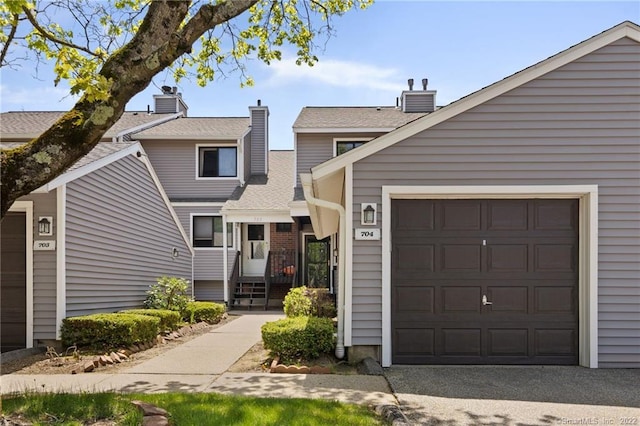 704 Mill Pond Dr Unit 704, South Windsor, CT 06074 - townhome / multi-family property featuring a chimney and a garage