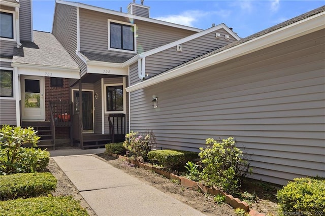 704 Mill Pond Dr Unit 704, South Windsor, CT 06074 - entrance to property with a chimney and brick siding