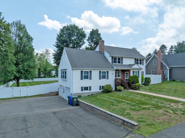 263 New Britain Ave, Newington, CT 06111 - view of front of property with a gate, a chimney, an attached garage, and asphalt driveway