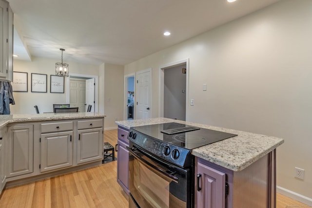 263 New Britain Ave, Newington, CT 06111 - kitchen featuring black / electric stove, light wood-style flooring, recessed lighting, light stone countertops, and pendant lighting