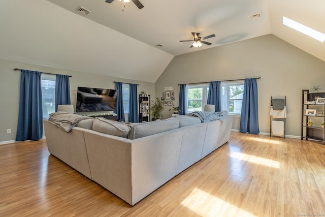 263 New Britain Ave, Newington, CT 06111 - living area featuring a ceiling fan, lofted ceiling, light wood finished floors, and a skylight