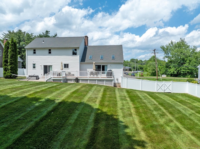 263 New Britain Ave, Newington, CT 06111 - rear view of house with a fenced backyard, a wooden deck, and a chimney