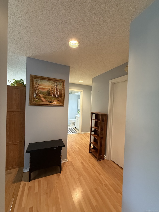 13 Heritage Vlg Unit E, Southbury, CT 06488 - corridor with a textured ceiling, wood finished floors, and recessed lighting