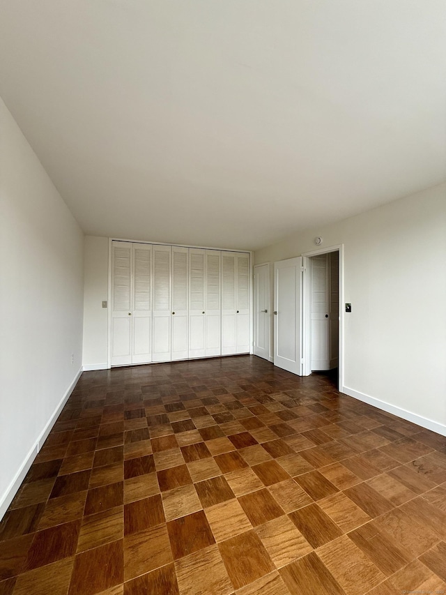 1 Strawberry Hill Ct Apt 2D, Stamford, CT 06902 - unfurnished bedroom featuring baseboards
