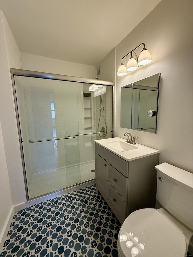 1 Strawberry Hill Ct Apt 2D, Stamford, CT 06902 - bathroom featuring a stall shower, vanity, and tile patterned floors