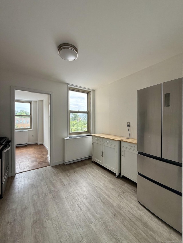 1 Strawberry Hill Ct Apt 2D, Stamford, CT 06902 - kitchen with stainless steel appliances, plenty of natural light, and light wood finished floors