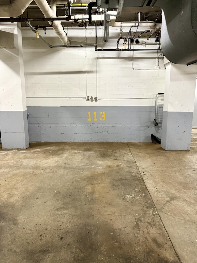 1 Strawberry Hill Ct Apt 2D, Stamford, CT 06902 - parking deck featuring concrete block wall