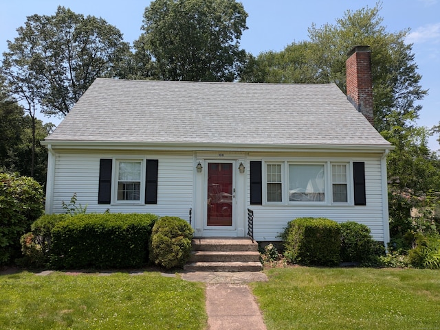 108 White St, Manchester, CT 06042 - new england style home with a front lawn, a chimney, and a shingled roof