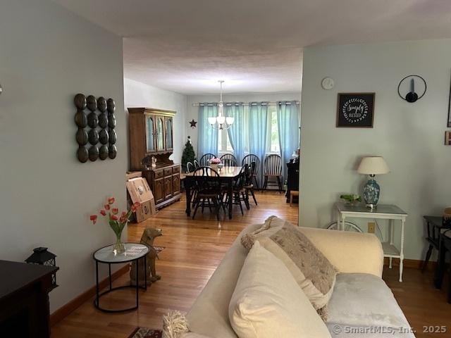 450 Toll Gate Rd, Groton, CT 06340 - living area with wood finished floors and a chandelier