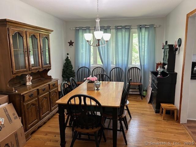 450 Toll Gate Rd, Groton, CT 06340 - dining space featuring a chandelier and light wood-type flooring