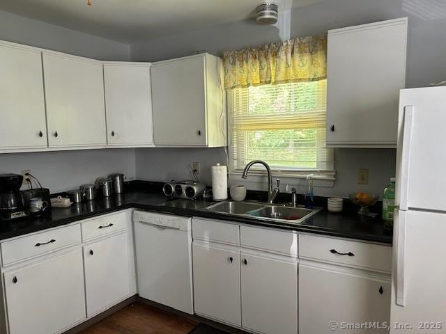 450 Toll Gate Rd, Groton, CT 06340 - kitchen featuring white appliances, dark countertops, and white cabinetry