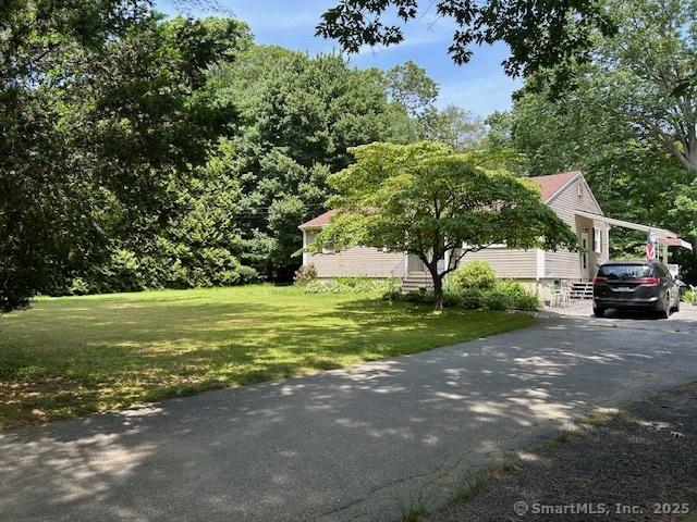 450 Toll Gate Rd, Groton, CT 06340 - view of property exterior with a yard and driveway