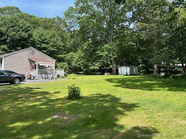 450 Toll Gate Rd, Groton, CT 06340 - view of grassy yard featuring a storage shed