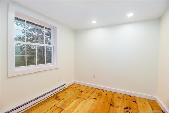 69 Forest Dr, Newtown, CT 06482 - spare room featuring a baseboard heating unit, light wood finished floors, and recessed lighting