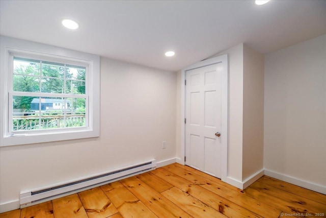 69 Forest Dr, Newtown, CT 06482 - empty room featuring baseboard heating, light wood finished floors, and recessed lighting