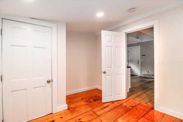 69 Forest Dr, Newtown, CT 06482 - hallway featuring light wood finished floors, a baseboard heating unit, and recessed lighting