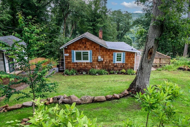 69 Forest Dr, Newtown, CT 06482 - view of front facade with a chimney and a front lawn
