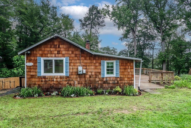 69 Forest Dr, Newtown, CT 06482 - view of property exterior with a deck, a chimney, and a yard