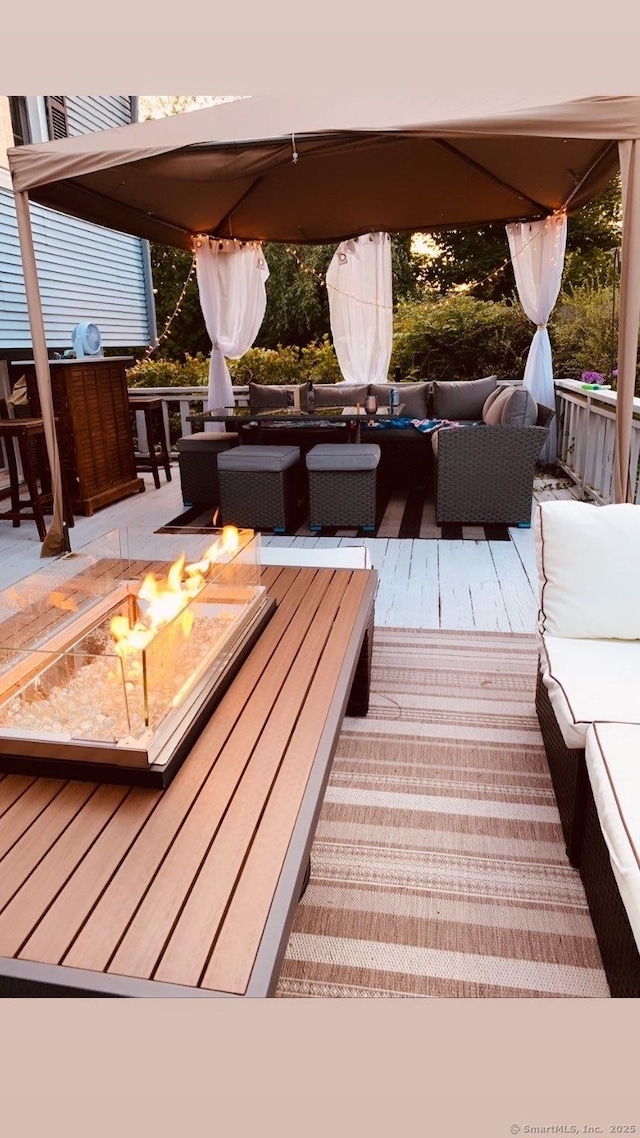 24 Cambridge Dr, Southington, CT 06489 - wooden terrace with an outdoor living space with a fire pit