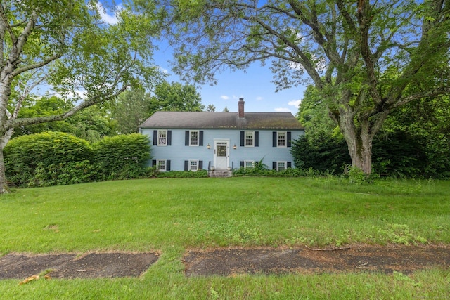 24 Cambridge Dr, Southington, CT 06489 - split foyer home featuring entry steps, a chimney, and a front yard