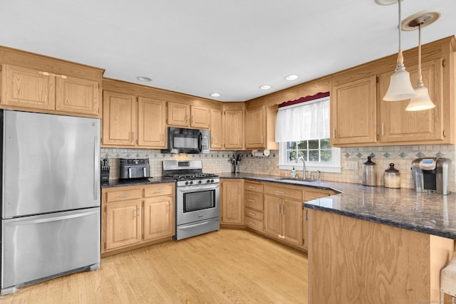 24 Cambridge Dr, Southington, CT 06489 - kitchen with appliances with stainless steel finishes, light wood finished floors, tasteful backsplash, pendant lighting, and recessed lighting