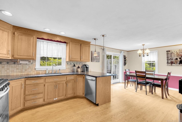 24 Cambridge Dr, Southington, CT 06489 - kitchen featuring appliances with stainless steel finishes, light wood finished floors, a peninsula, a chandelier, and backsplash