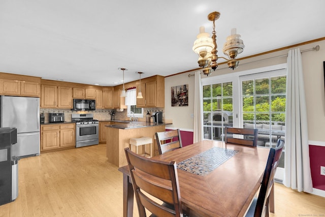 24 Cambridge Dr, Southington, CT 06489 - dining room featuring a chandelier, light wood-style floors, and crown molding