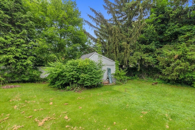 24 Cambridge Dr, Southington, CT 06489 - view of green lawn with a storage shed