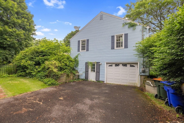 24 Cambridge Dr, Southington, CT 06489 - view of front of home with asphalt driveway and a garage